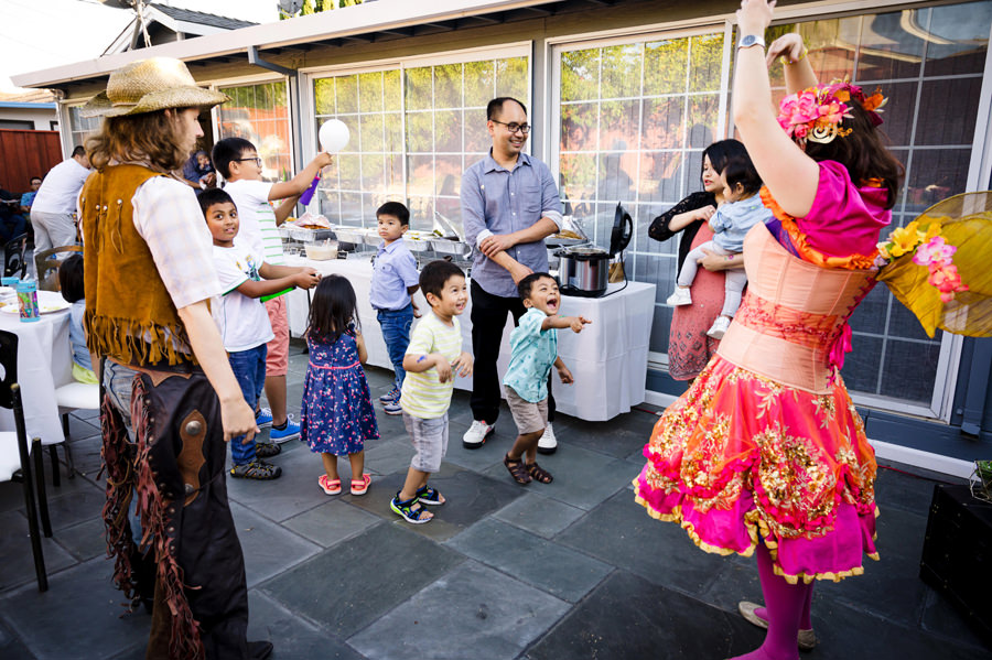Guests are having a dance and fun games at a 1st Birthday Party Celebration in San Jose.
