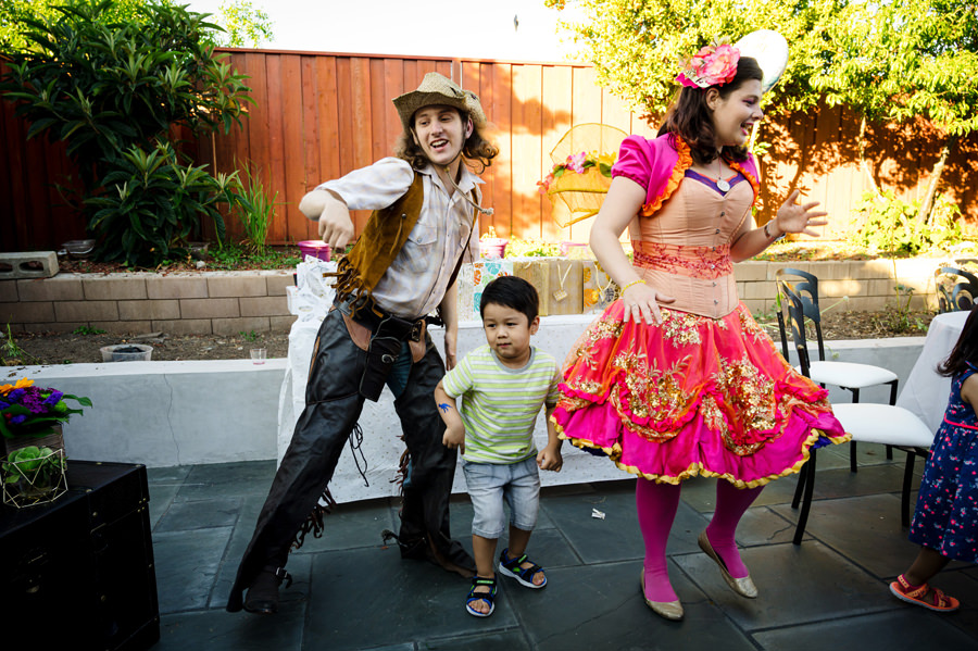 A boy dances with the Performers at a 1st Birthday Party Celebration.