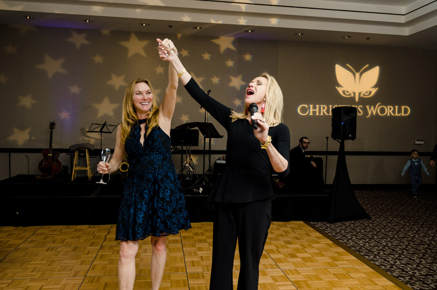 An image of a lady cheering her friend at her Birthday Party at Hotel Valencia in Santana Row 