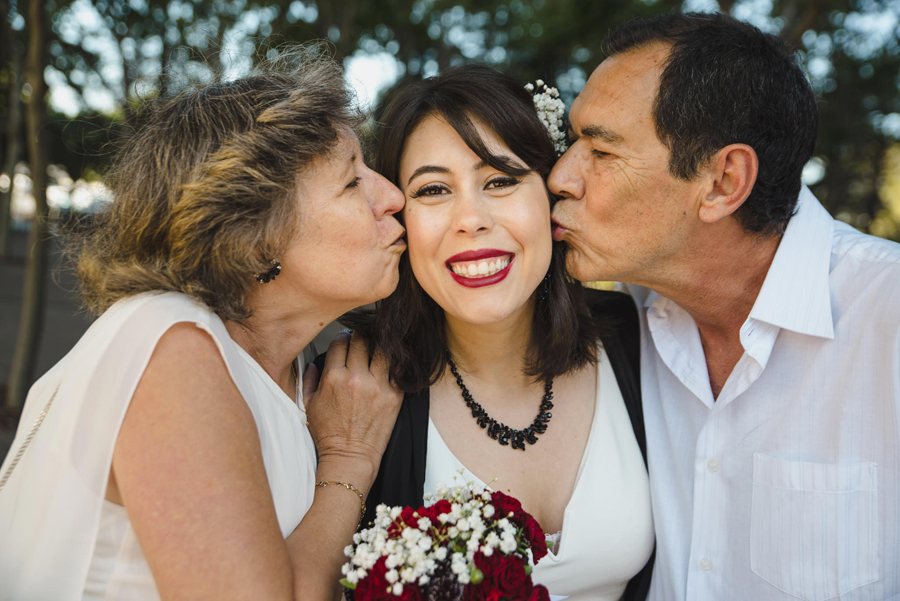 A bride kissed by her parents before her Wedding Ceremony at the San Jose Clerk Recording Office
