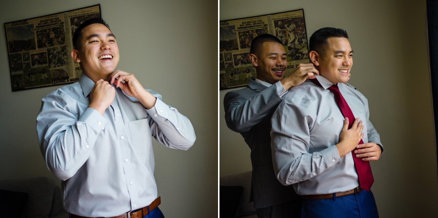 A groom putting on his tie with a help by one of his groomsmen
