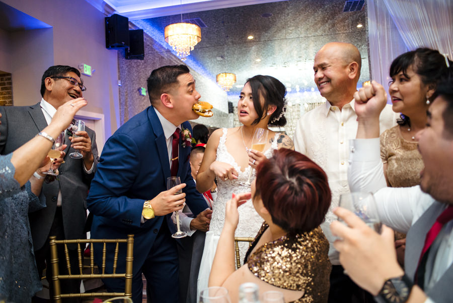 A funny image taken during the table visit at the reception of their Wedding at Casa Bella in Sunol, CA.