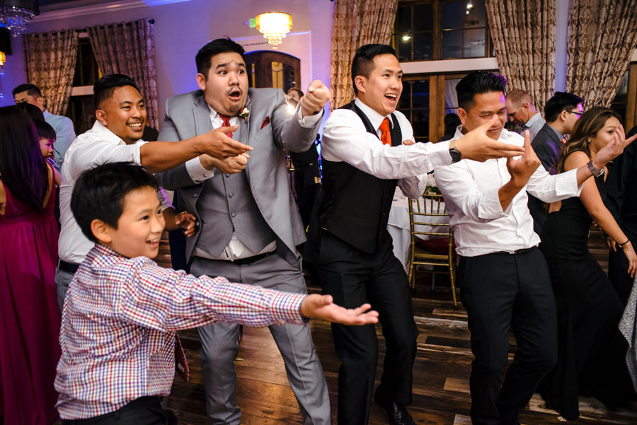 A funny image of guests dancing at a wedding reception