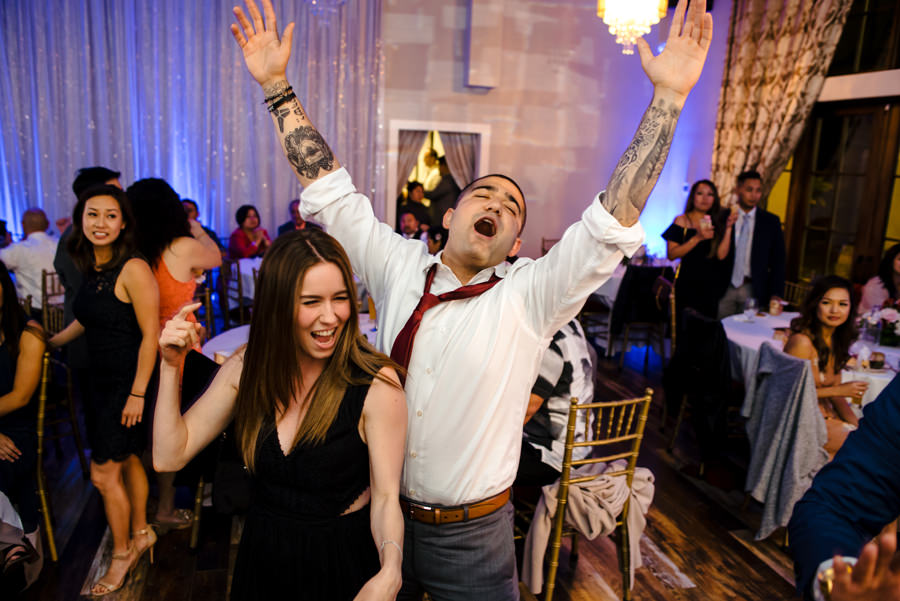 An image of guests dancing at a wedding reception