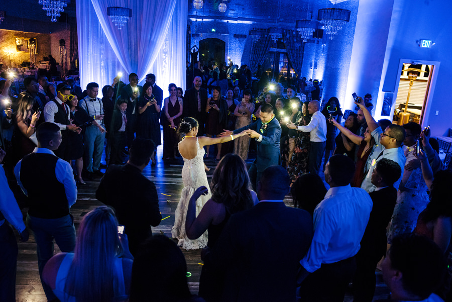 A great image of bride and groom surrounded by their friends and family during the last song dance at a Wedding at Casa Bella in Sunol, CA