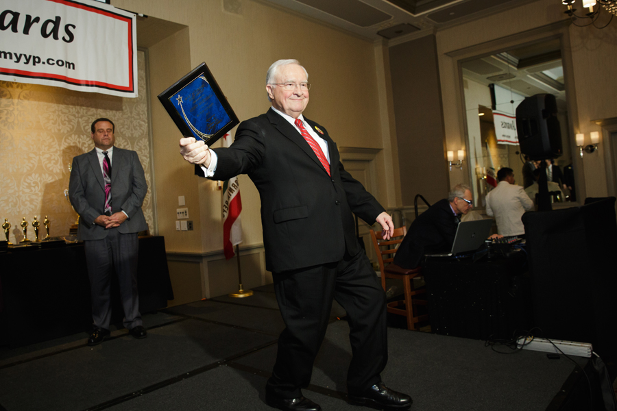CEO dances while displaying the award on the stage