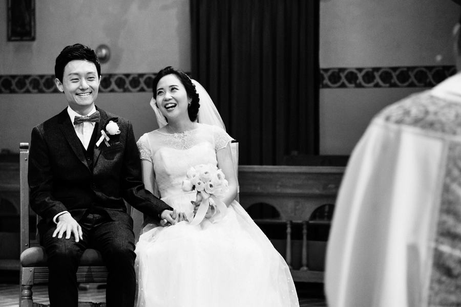Bride and Groom laughing on their Wedding ceremony at Santa Clara University Mission Church Wedding