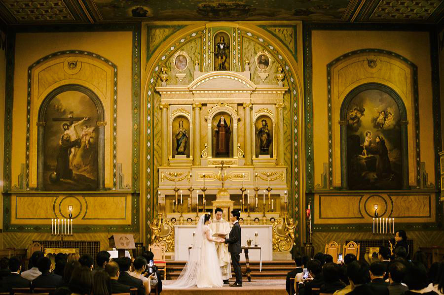 A beautiful of the Santa Clara University Mission Church altar during a Wedding ceremony