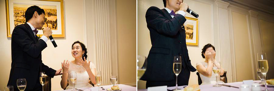 An embarassed bride being toasted by her husband
