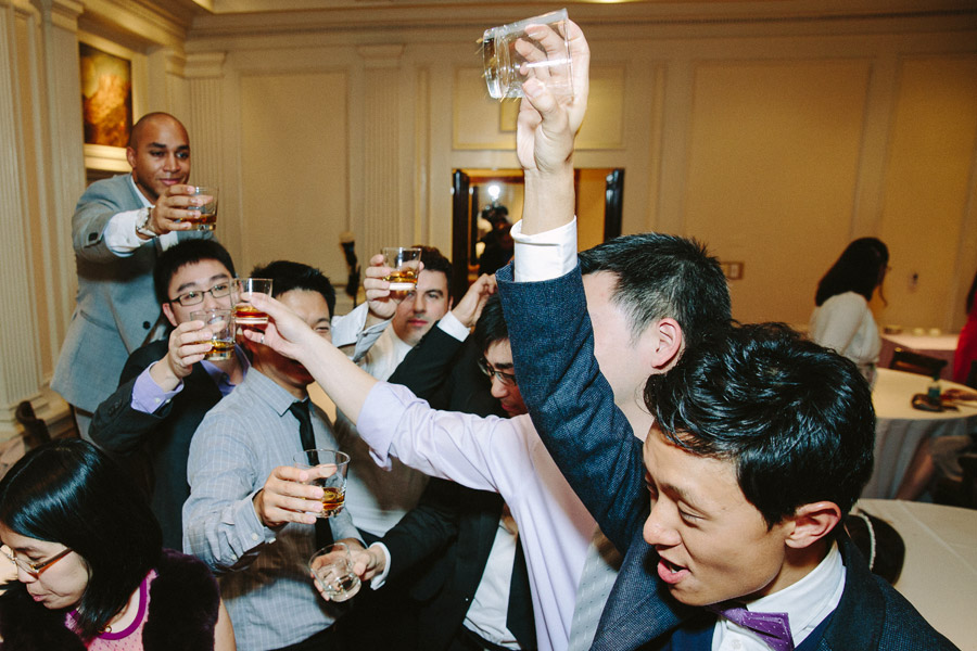 Groom and his buddies cheering for the shot