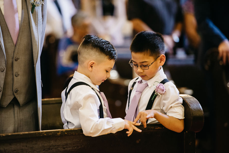 The ring bearers plays in the middle of the Wedding Ceremony
