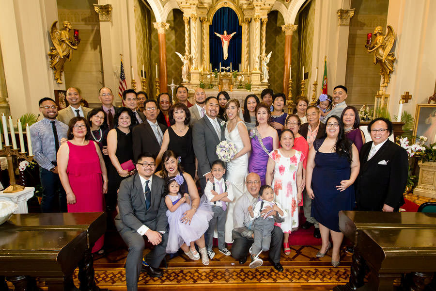 A cute formal picture of the Wedding Family on the altar