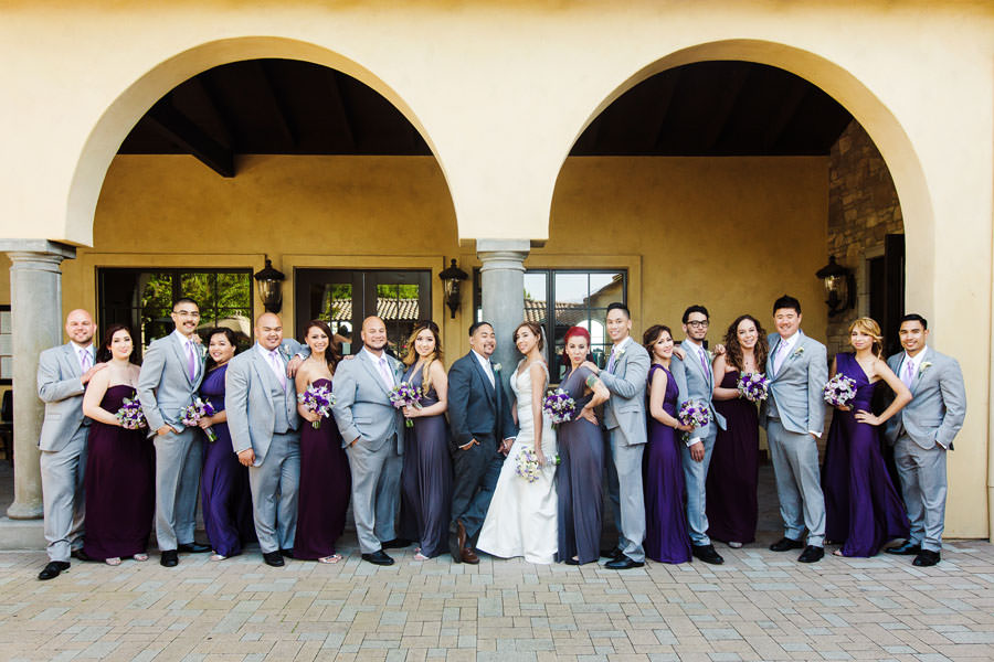 A shot of the Bridal Party standing between beautiful pillars