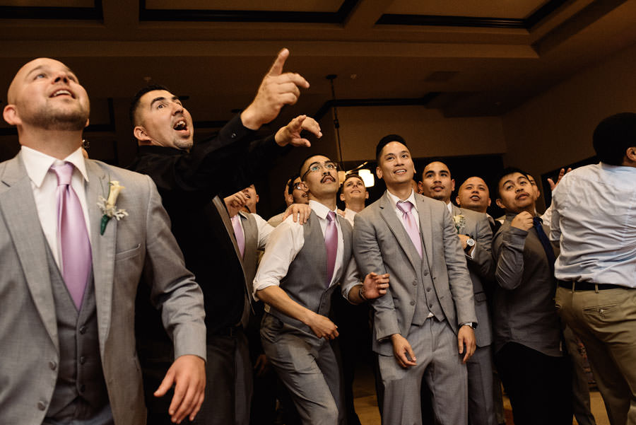 A picture of single guys waiting to catch the garter